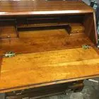 A wooden desk with two drawers and a small compartment.