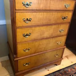 A dresser that is sitting on the floor.