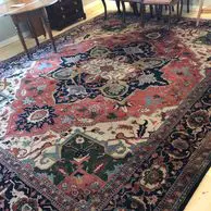 A large rug in the middle of a room.