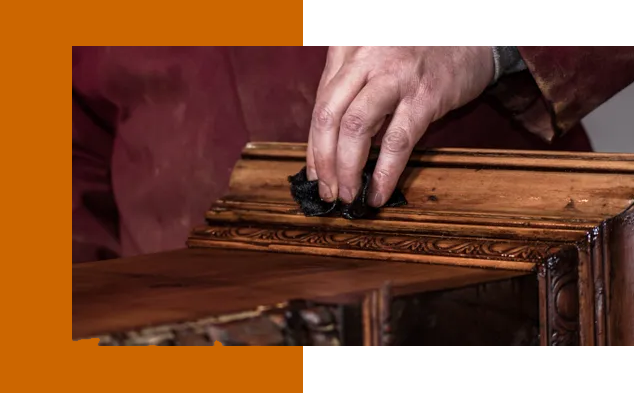 A person is holding onto the edge of a wooden shelf.